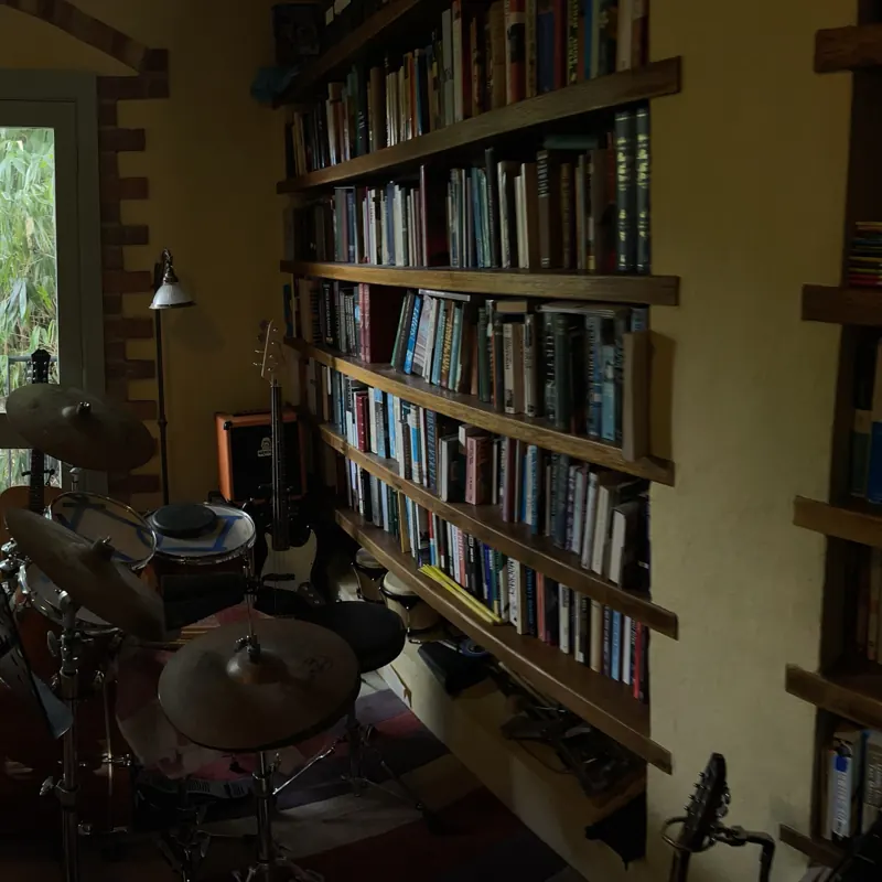 Drum kit and bookshelves in the studio